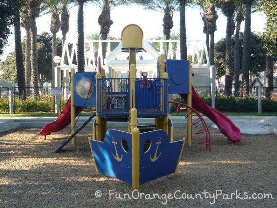 38th Street playground with blue bow of ship and view of play structure