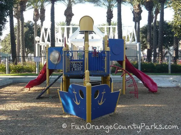 38th Street playground with blue bow of ship and view of play structure