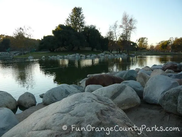 mason regional park irvine - lake with boulders surrounding shore