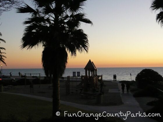 Aliso Beach Park view of sunset with palm trees
