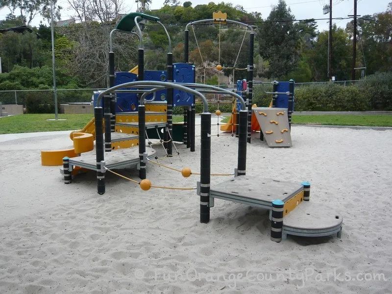 play area for younger kids with balancing and climbing apparatus