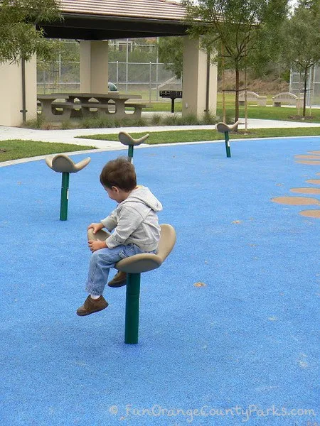 playgrounds spinners with little boy