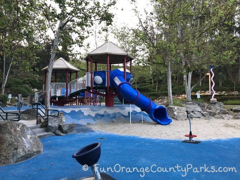 View of twisty slide and spinners at Olympiad Park