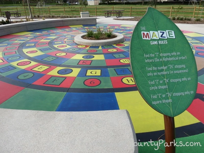 maze game with colorful concrete stamped with letters and numbers in concentric circles