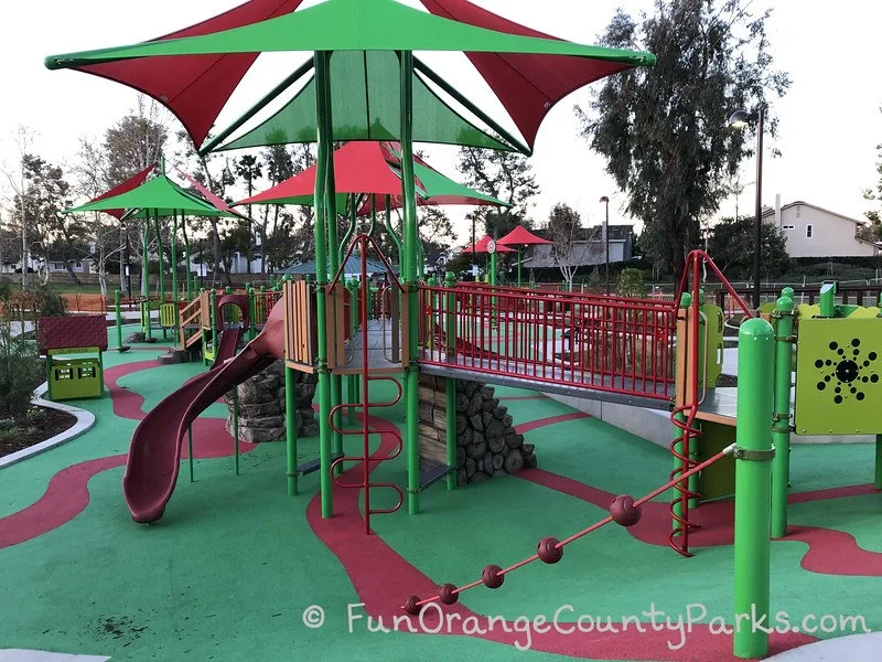 playground with green and red shade cover 