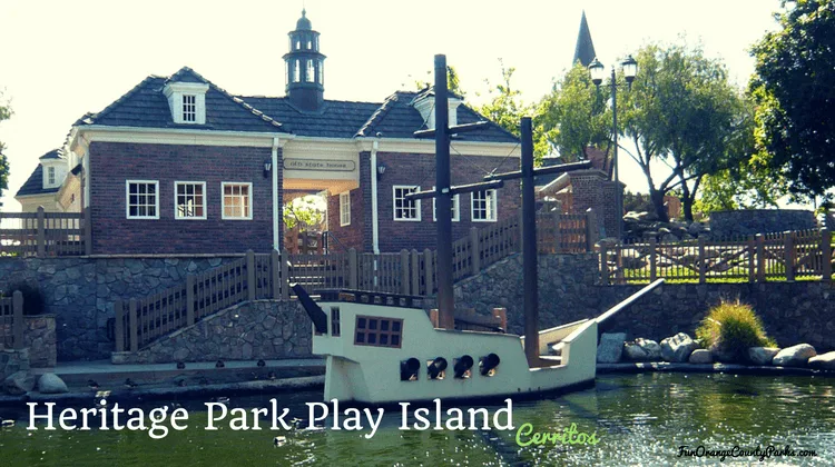 Heritage Park Play Island playground with concrete ship below colonial building