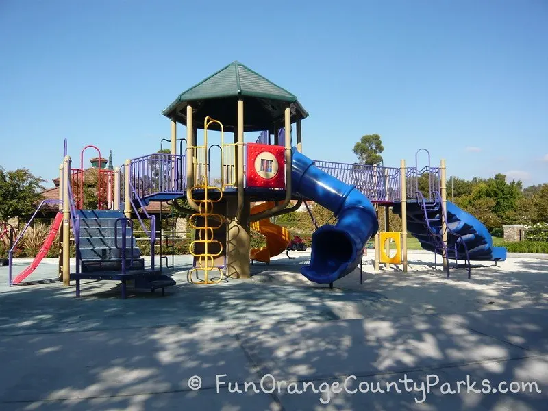 Blue tunnel slide and big playground at Melinda Park in Mission Viejo