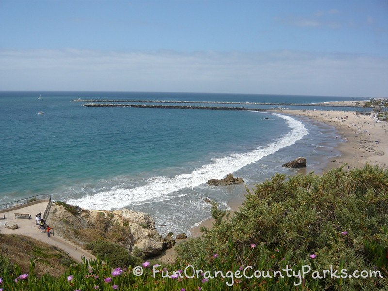 parks and beaches parking passes - corona del mar beach view of beach and Newport Harbor entrance from bluff above the beach