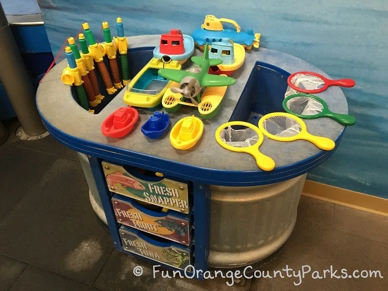 Pretend City marina toys like plastic fishing poles and fishing nets for kids