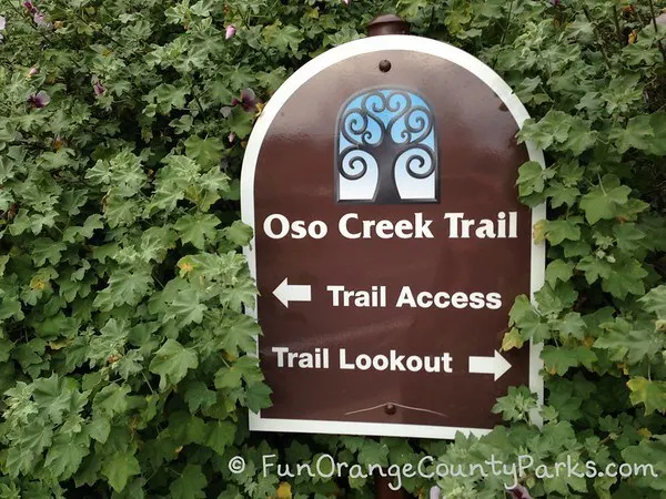 Oso Creek Trail sign with an arrow pointing left for Trail Access and right for Trail Lookout