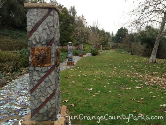 oso creek trail grass area with mosaic art installations