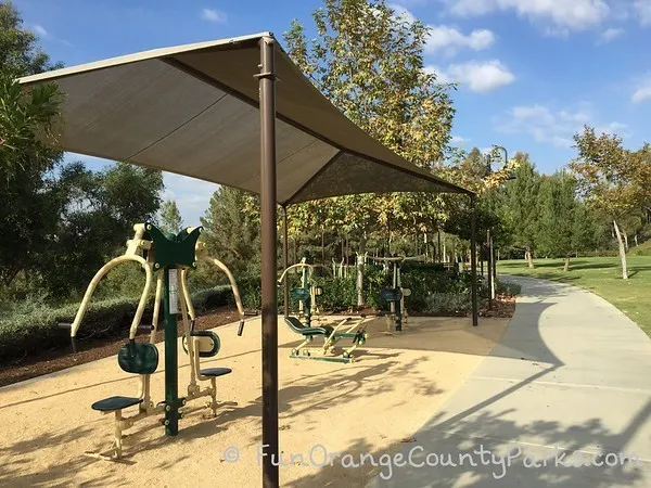 workout equipment at oso viejo park in mission viejo under a sun shade