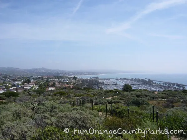 view from the top of the Dana Point Headlands over Dana Point Harbor down to San Clemente 