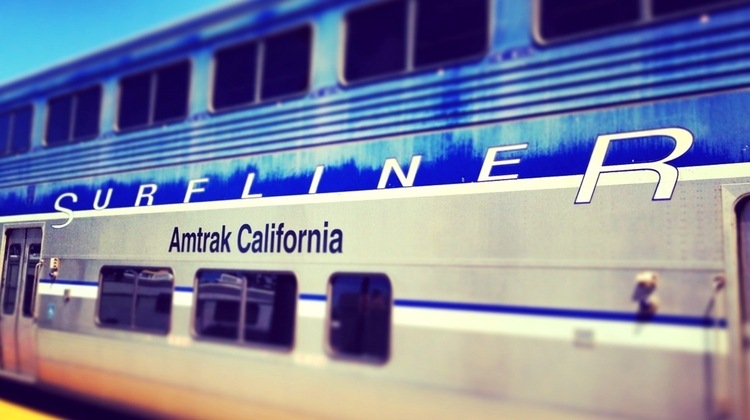 winter break play ideas - train trip on amtrak pictured up close with Surfliner on the side of the train