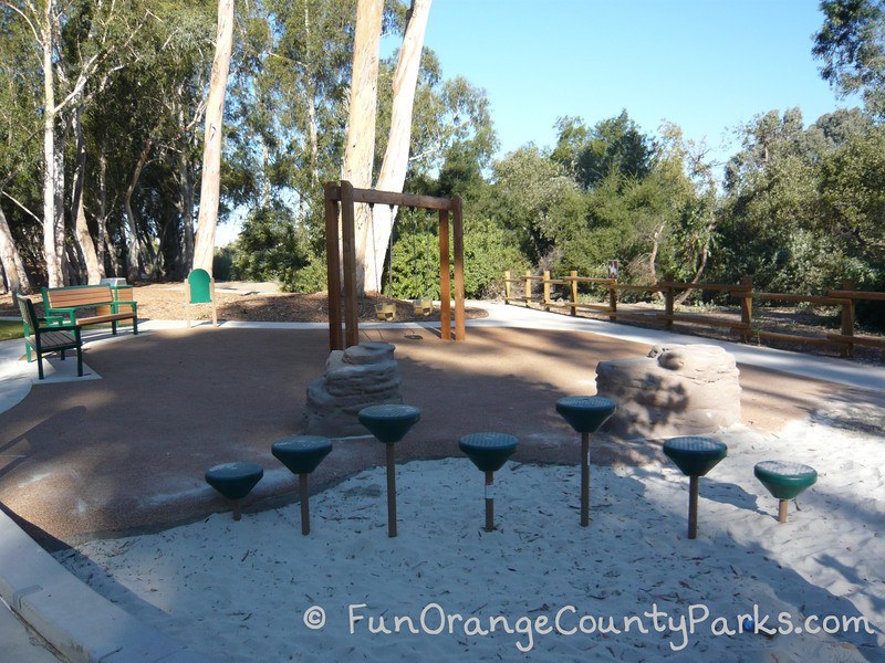 serrano creek park lake forest - pedestal play area and swings