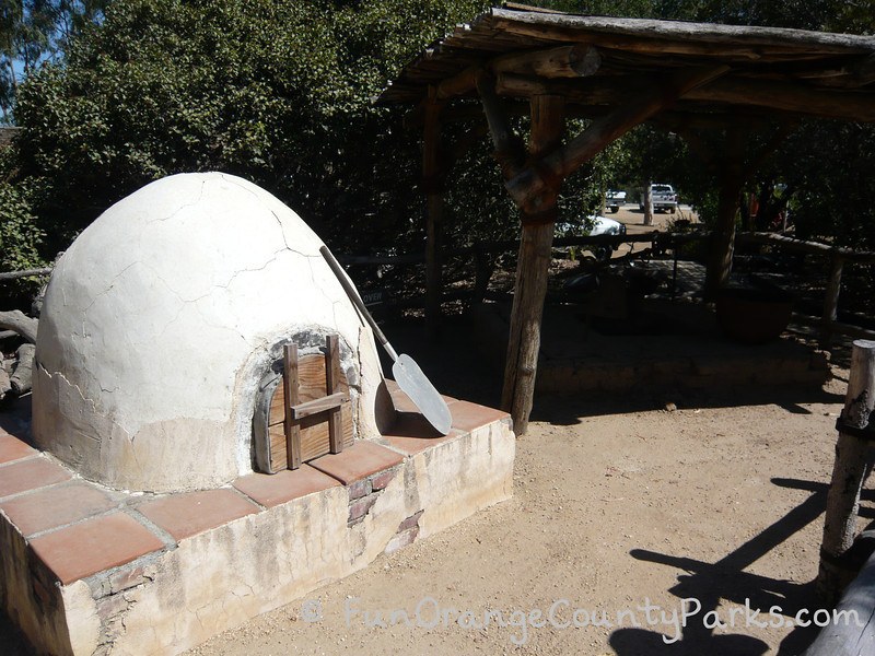 outdoor oven white dome on a platform with red tile