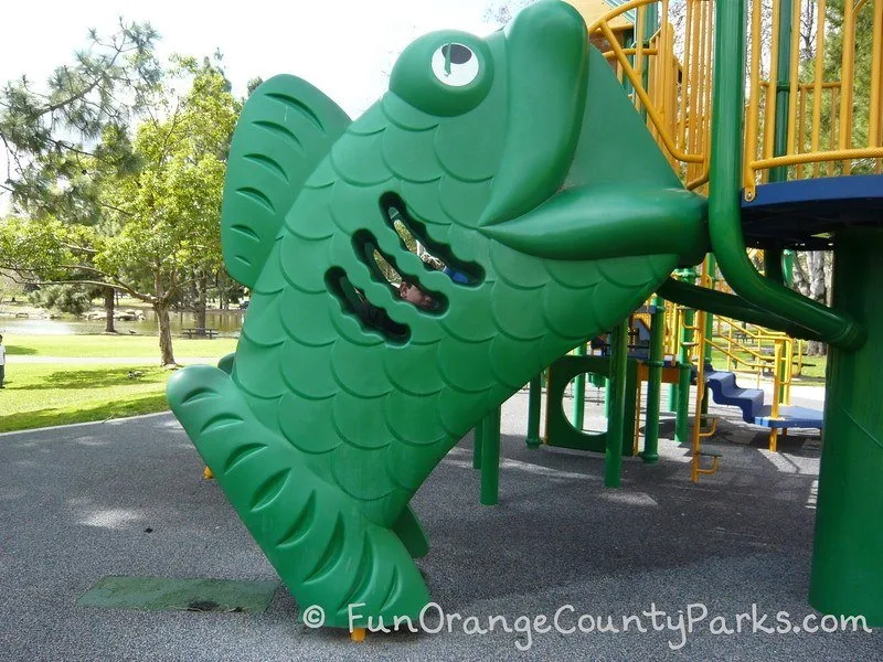 Green fish stair climber onto playground equipment at Yorba Regional Park