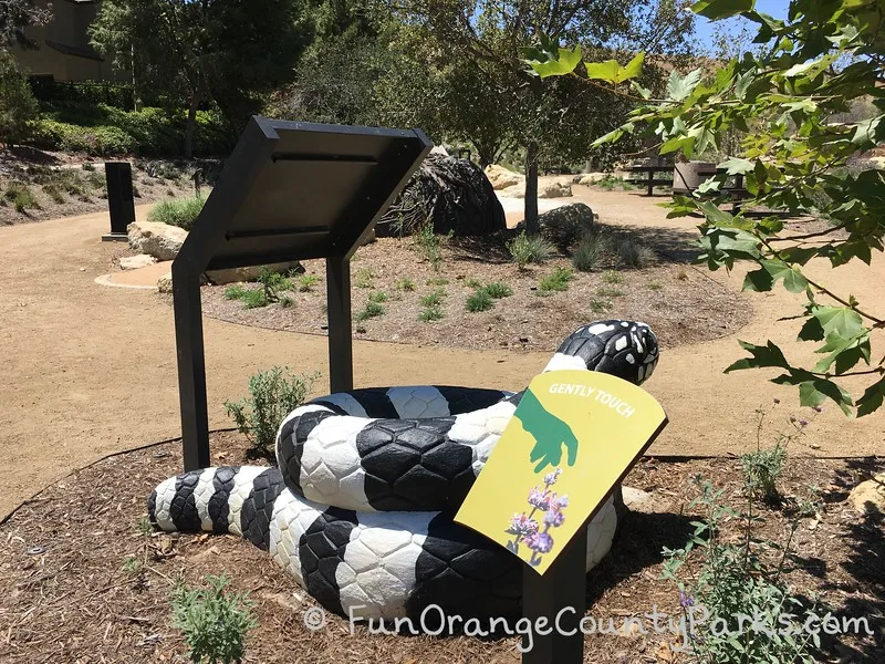 king snake sculpture at play area