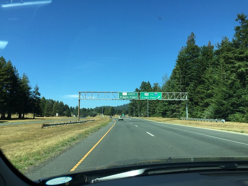 winter break play ideas road trip to the Oregon Coast with the highway and road signs on the way to the Oregon Coast