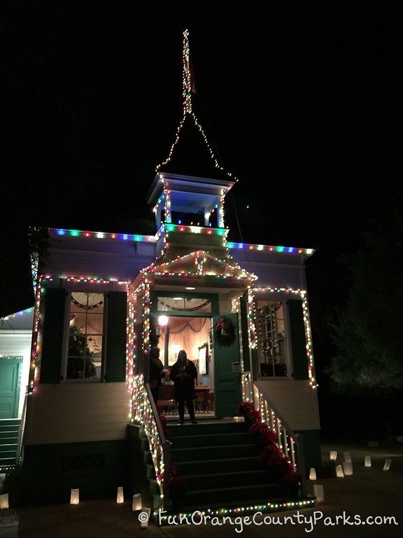 Candlelight Walk at Heritage Hill schoolhouse all lit up with holiday lights