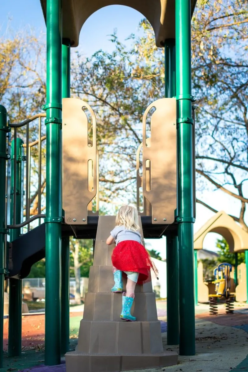 photograph your children girl climbing at playground