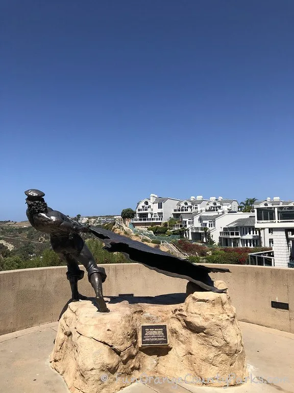 bronze sculpture of man and hide