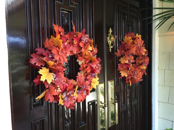 front doors with two fall leaf wreaths