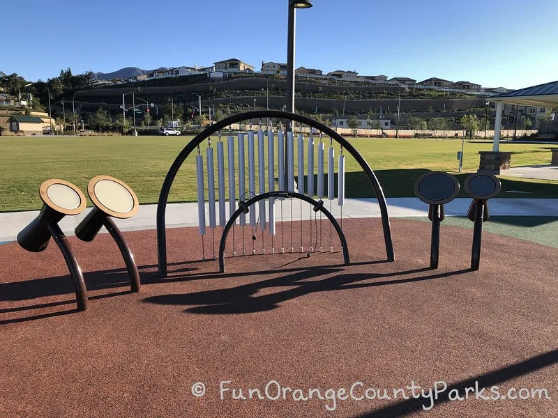 musical instrument playground equipment with large field in background