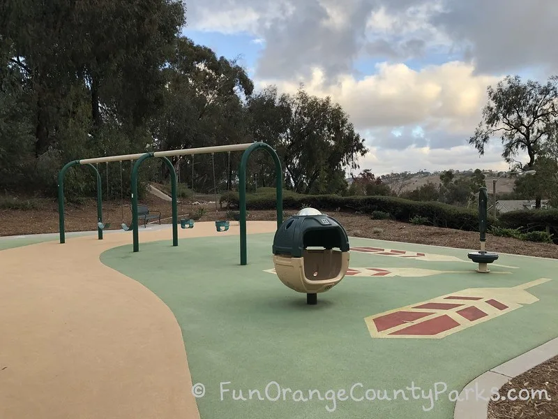 swingset with bench swings and baby swings at Seminole Park playground
