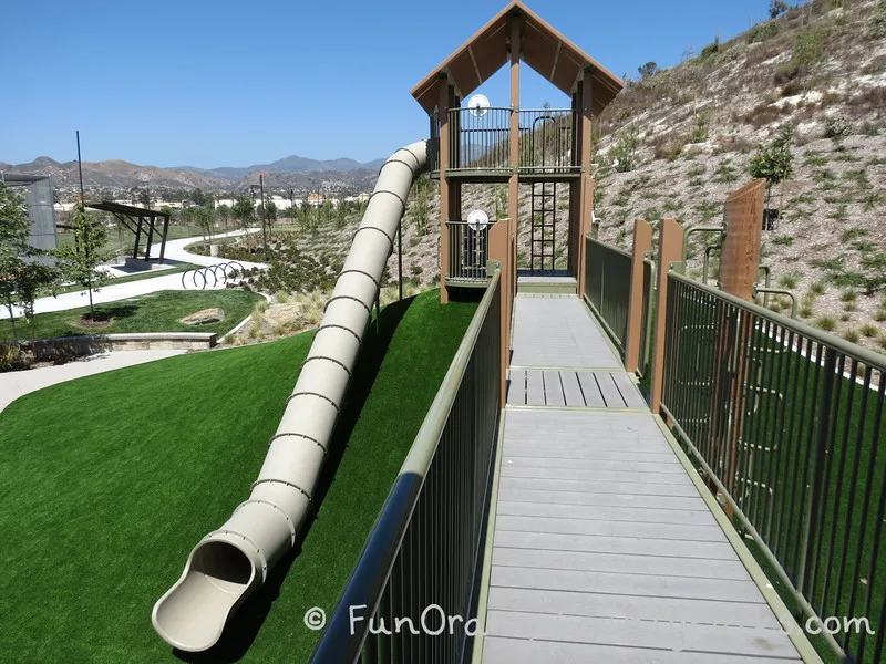 Another view of the amazing tunnel slide to really get an idea of how long it is - showing the walkway on the play equipment and other parts of the park in the background