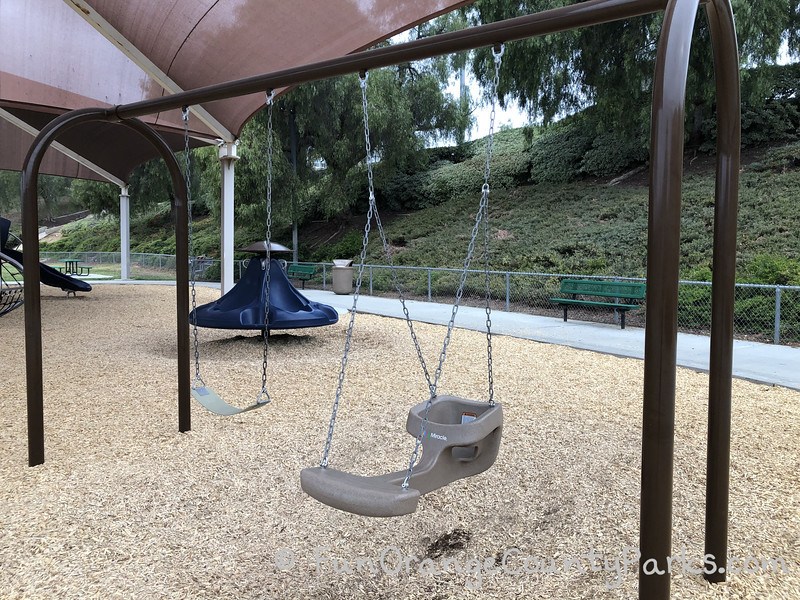 one regular bench swing and one swing-with-me swing which has room for a baby and a parent or sibling to swing along