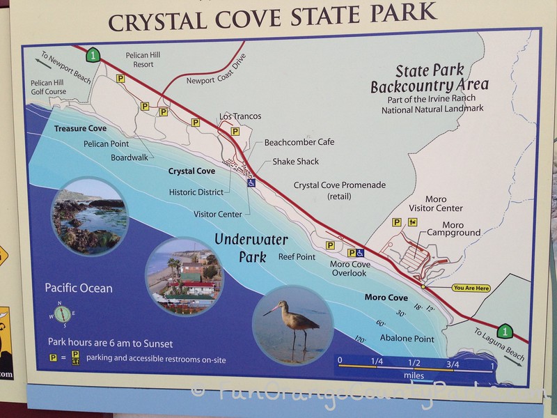 sign showing map of crystal cove state park highlighting moro cove, reef point, the historic district, pelican point and treasure cove on the north end