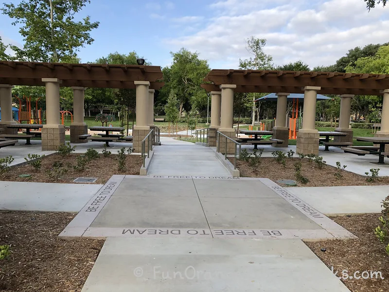 "be free to dream" stamped on concrete at the entrance to the playground