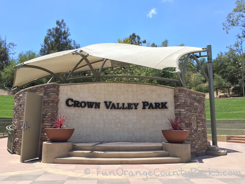 view of crown valley park amphitheater with lawn hills side and blue skies