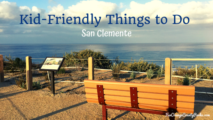 bench looking out over the ocean with clouds on a calm day