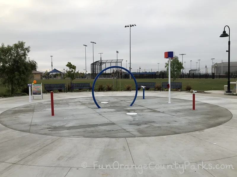 splash pad at Veterans Sports Park at Tustin Legacy with no water turned on - it just looks like a blue circle and a few small poles which will have water come spraying out