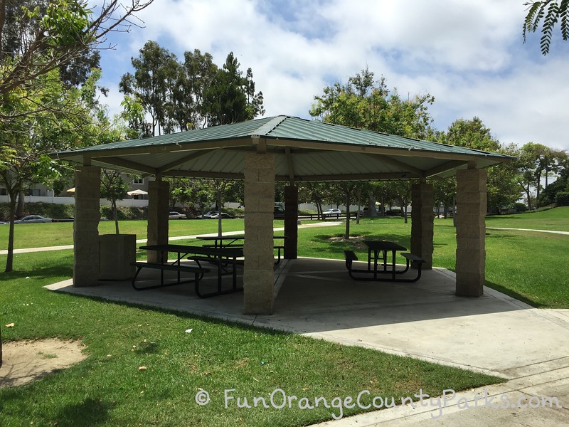 large covered picnic gazebo with 3 large shaded picnic tables