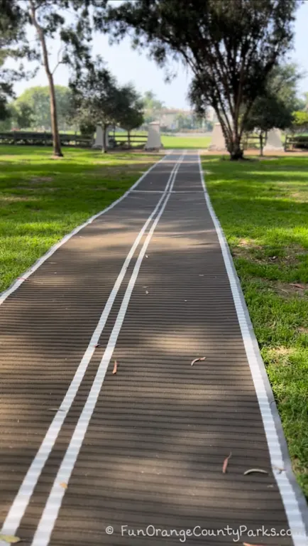 accessible path set over lawn area at Gibbs Butterfly Park in Huntington Beach